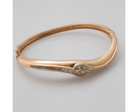 Ladies 18ct yellow gold diamond set hinged bangle, the bangle set with 1.7 carats of baguette diamonds, weighs approx 22.8gm
