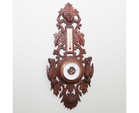 Wall barometer with thermometer in Black Forest style carved case with Woodpeckers 