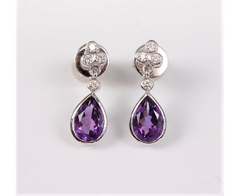 A pair of 18ct white gold amethyst and diamond earrings, the pear shaped amethyst in collet mount, with a single round diamon