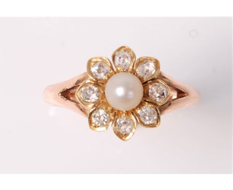 A pearl and diamond flowerhead cluster ring, the pearl, approx. 4.4mm diameter, surrounded by eight old cut diamonds, total e