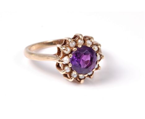 A 9ct amethyst and pearl ring, the round amethyst, approx, 7.1mm diameter, surrounded by small cultured pearls, all claw set 