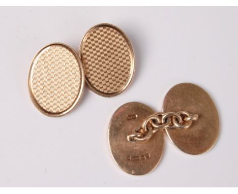 A pair of 9ct cufflinks, the oval engine turned engraved cufflinks, hallmarked Birmingham 1964, (13.1g), cased
