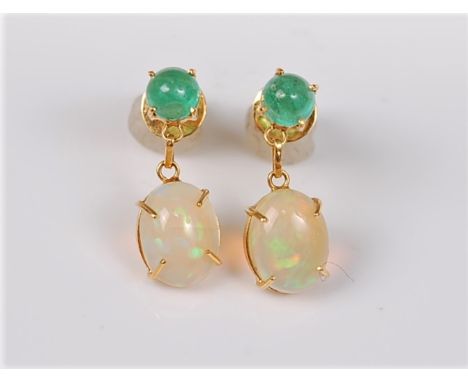 A pair of emerald and opal earrings, the oval opal cabochon drops claw set and surmounted by a round emerald cabochon, all in