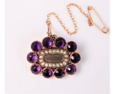 A 19th century amethyst, seed pearl and memorial brooch, the central hairwork glazed panel, surrounded by seed pearls amethys
