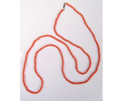 A coral bead necklace, the roughly uniform beads approx. 4mm diameter, with white metal barrel clasp, (25.1g)   Condition Rep