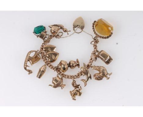 9ct gold charm bracelet, set with twelve 9ct gold marked charms and two plated metal charms. 55g