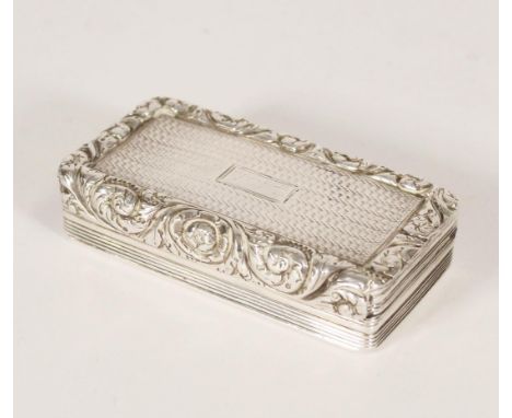 Antique George IV silver snuff box of rectangular shape the top surface with engine turned filed, relief scroll and floral bo