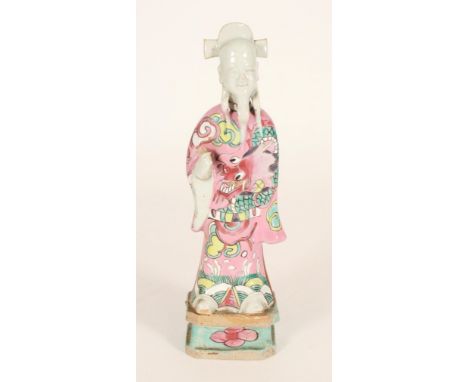 Chinese Famille Rose figure of an Immortal, 19th century, the flowing robe decorated with dragon amongst clouds, H23cm. Condi