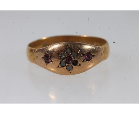 Victorian 22ct gold ruby and white stone ring, the small stones prong set in a flower head form, size P/Q, 2.8g.