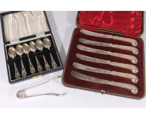 Cased set of six hallmarked silver handled pistol grip butter knives, cased set of silver teaspoons with pierced thistle term