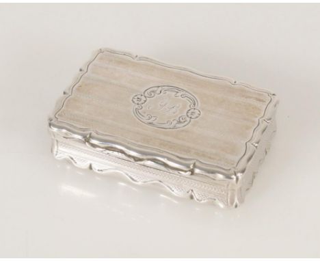 Antique Victorian silver snuff box of rectangular shape having serpentine edge and engine turned decoration, by Edward Smith,