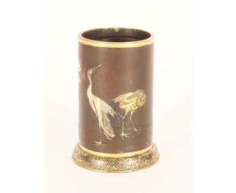 Japanese mixed metal inlaid bronze brush pot, decorated in bronze, silver and copper with gilt highlights with storks among w