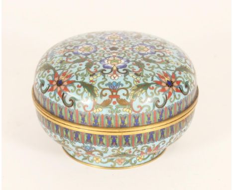 Chinese cloisonne jar and cover, the repeating polychrome foliate patterns on a light blue ground, W12cm. Condition - Good co