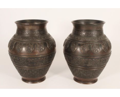 Pair of Chinese bronze baluster vases, decorated in the bands with repeating clouds, targets, waves and other motifs, H24cm