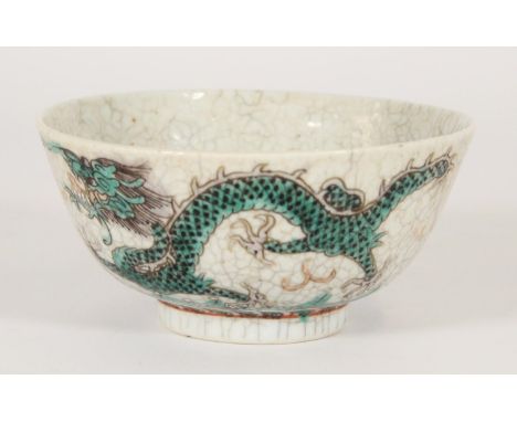 Chinese porcelain Famille Verte green dragon bowl, Qing period, the green enamelled dragons chasing a flaming pearl amongst c