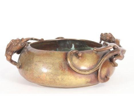Chinese large bronze censer or washer bowl, of globular form with cast Kuilong dragon handles, the body engraved with figures