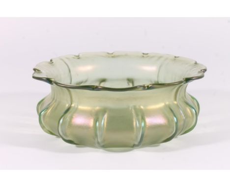 Loetz iridescent glass bowl, early 20th century, the shaped rim over a ribbed squat body, W20cm.