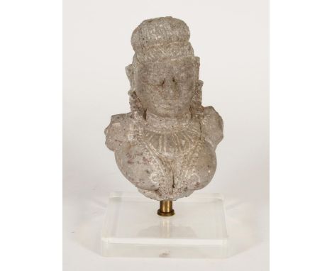 Indian stone bust of a Goddess, raised on modern flat pedestal base, H20cm. Condition - good condition with expected light we