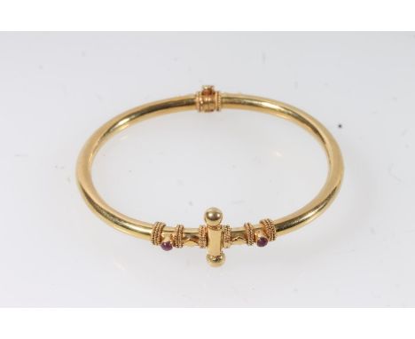 Indian yellow metal bangle set with two cabochon rubies. 15g