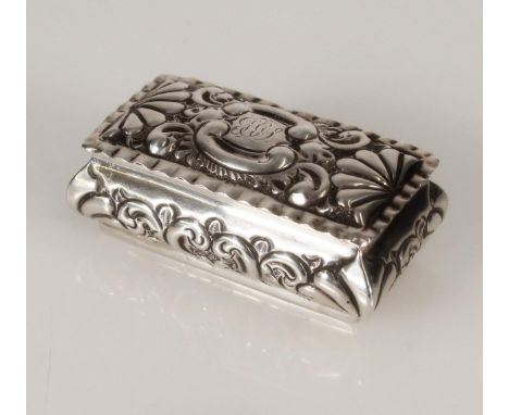 Antique Victorian silver snuff box of sarcophagus form decorated with repoussé and chased C scroll and shell motifs, by Deaki