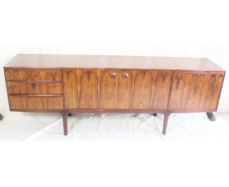 A.H.McIntosh of Kirkcaldy retro sideboard with pair of cupboard doors flanked by three drawers and a cabinet, 213cm wide x 46