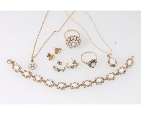 Harlequin suite of opal set gold jewellery to include a 9ct gold bracelet, 10.5g, a 9ct gold cluster ring, size Q, 6.2g, a 9c