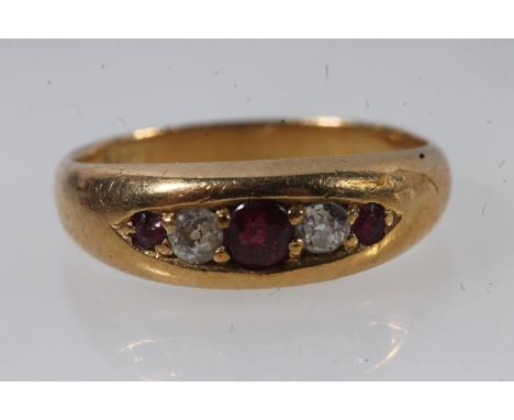 Early 20thC 18ct gold ruby and diamond ring, the graduating stones in a clawed boat setting on a tapering plain band, size L,