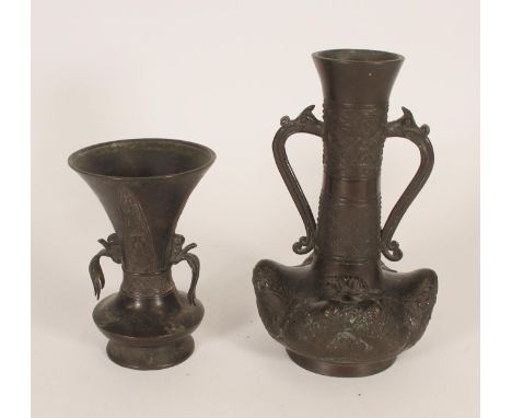 Chinese bronze vase, the flared rim over dragon headed loop handles, decorated with waves and ocean themes with cast Longgui 
