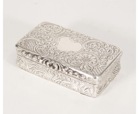 Antique Victorian silver snuff box of rectangular form decorated all over with incised scroll design, the edges slightly conc