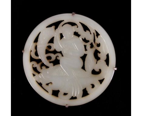 Chinese celadon jade small plaque brooch, Qing period, the circular reticulated plaque decorated with a boy riding the dragon