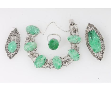 Chinese jade and white metal jewellery, the spinach green jade plaques finely carved and set in white metal and marcasite mou