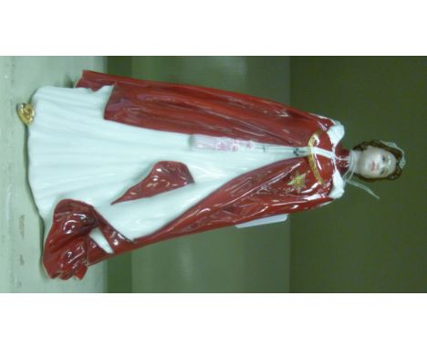 A Royal Worcester china figure, made to celebrate the Queens 80th Birthday  9''h       OS2