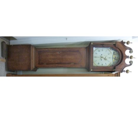 An early 19thC country made, honey coloured oak longcase clock, the hood having a swan neck pediment, over an arched, glazed,