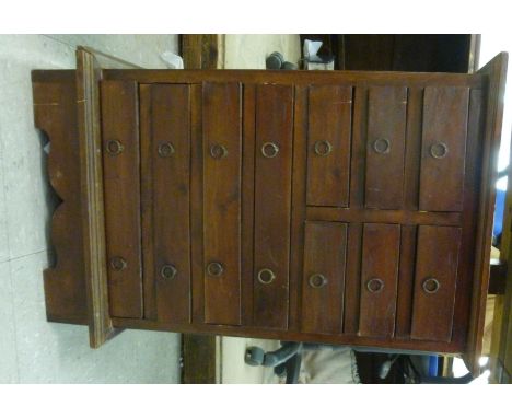 A modern mahogany finished ten drawer collector's cabinet, on bracket feet  24''h 16''w       SR