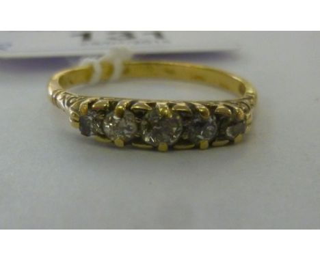 An 18ct gold ring, set with five in-line diamonds         11