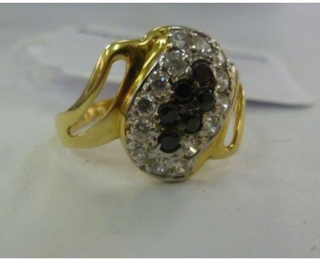 A gold coloured metal ring, set with sapphires and diamonds  stamped 750       11