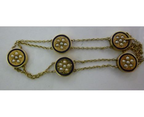 A late Victorian 15ct gold bracelet, having five blue enamel circular tablets, set with seed pearls, connected with two paral
