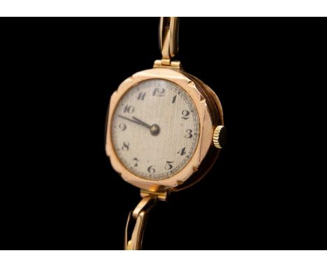 A 1920's 9ct cased lady's manual wind wristwatch with 9ct expanding bracelet. The 20mm guilloche dial with Breguet numerals, 