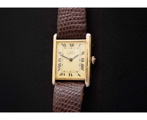 MUST DE CARTIER - A tank-cased silver gilt gentleman's manual wind wristwatch. No. 6 073187, the 17mm signed cream painted di