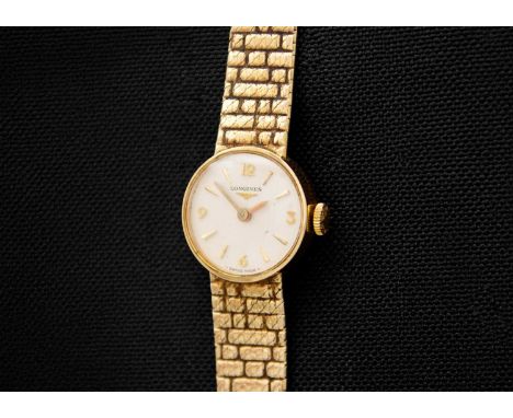 LONGINES - A 9ct lady's manual wind bracelet wristwatch. Ref. 410, the signed 15mm silvered dial with gilt quarter numerals a
