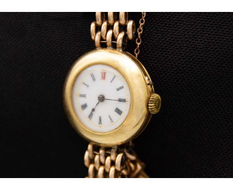 An early 20th century 18ct cased manual wind lady's watch with 15ct bracelet. The watch with 18ct back and cuvette, both stam