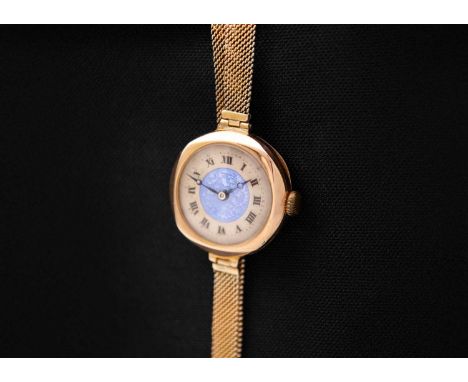 An attractive 1920's 9ct lady's manual wind bracelet wristwatch. The 20mm silvered and blue guilloche enamel dial with black 