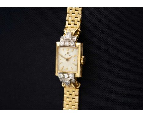 OMEGA - An 18ct lady's manual wind diamond set bracelet wristwatch. Cal. 244, circa 1950, the signed 10mm silvered dial with 