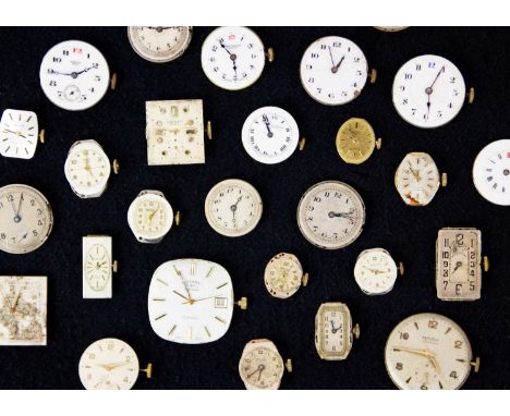 A collection of manual wind wristwatch movements and dials for repairs or spares. Various Swiss makers and movements.