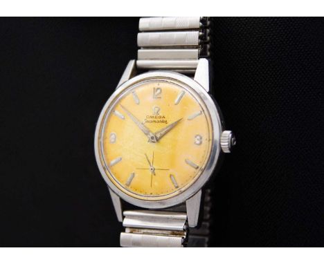 OMEGA - A Seamaster stainless steel manual wind gentleman's wristwatch with a 'tropical' dial. Cal. 268, the signed 28mm silv