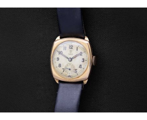 TUDOR - A 9ct cushion-cased gentleman's manual wind wristwatch. The signed 23mm silvered dial with luminous Arabic numerals, 