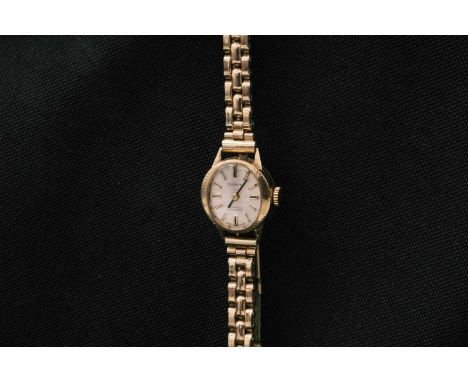 Two lady's 9ct cased manual wind wristwatches. One is by Record, with 15 jewel signed movement, generic gold-plated expanding
