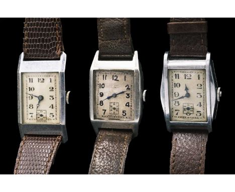 Three Art Deco gentleman's manual wind tank wristwatches. One in a silver case, with a silvered rectangular dial, 15 jewel Sw