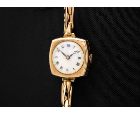 A 9ct rose gold lady's manual wind wristwatch with 9ct expanding bracelet. The 18mm white dial with Roman numerals and gilt d