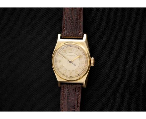 MOVADO FOR TIFFANY & CO. - A 14ct cased mid-sized gentleman's manual wind wristwatch. The 22mm gilt and cream chapter ring di